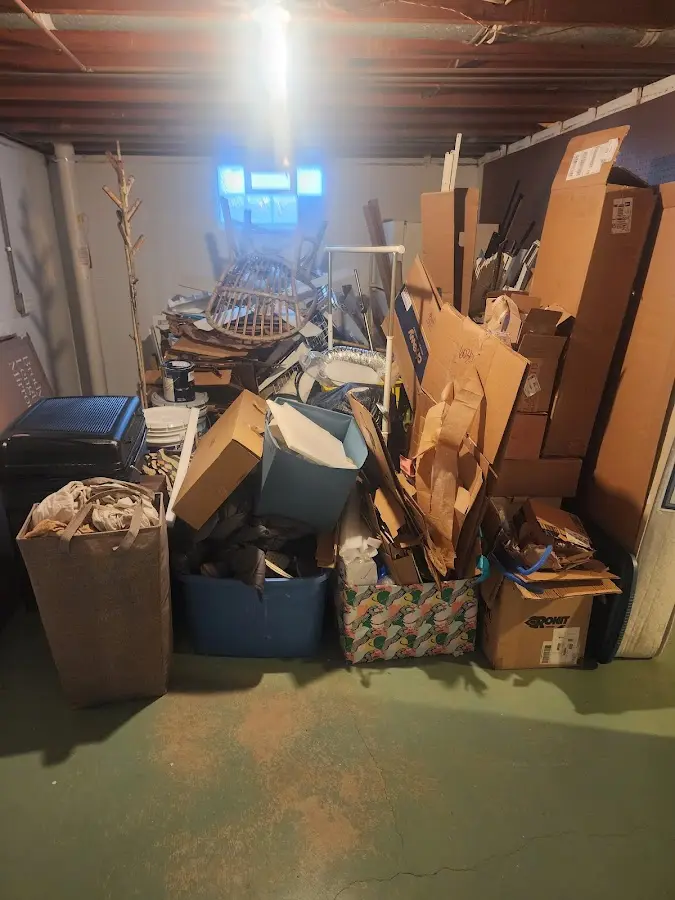 Roll-off dumpster container at job site for 20 Yard Dumpster Rental in Orchards